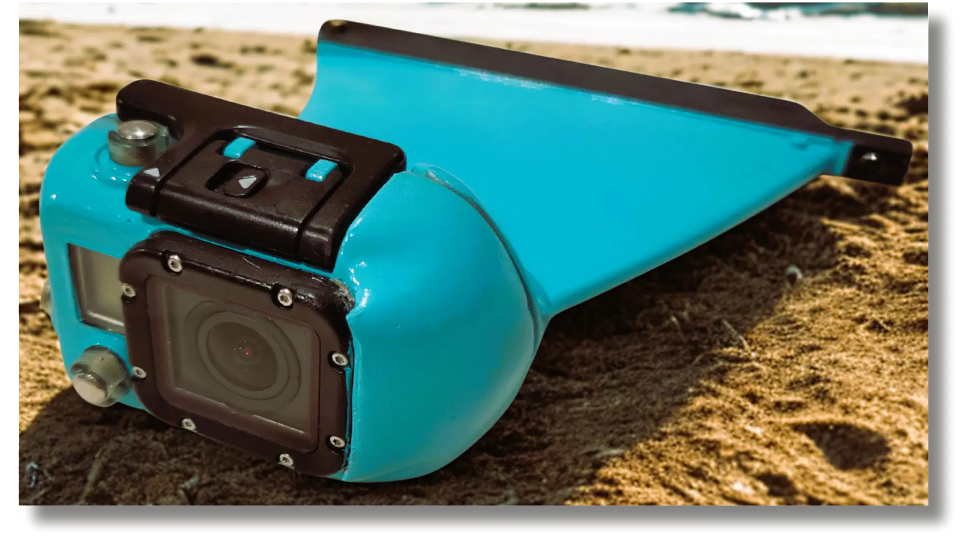 GoPro camera mounted in a golden fin-shaped housing